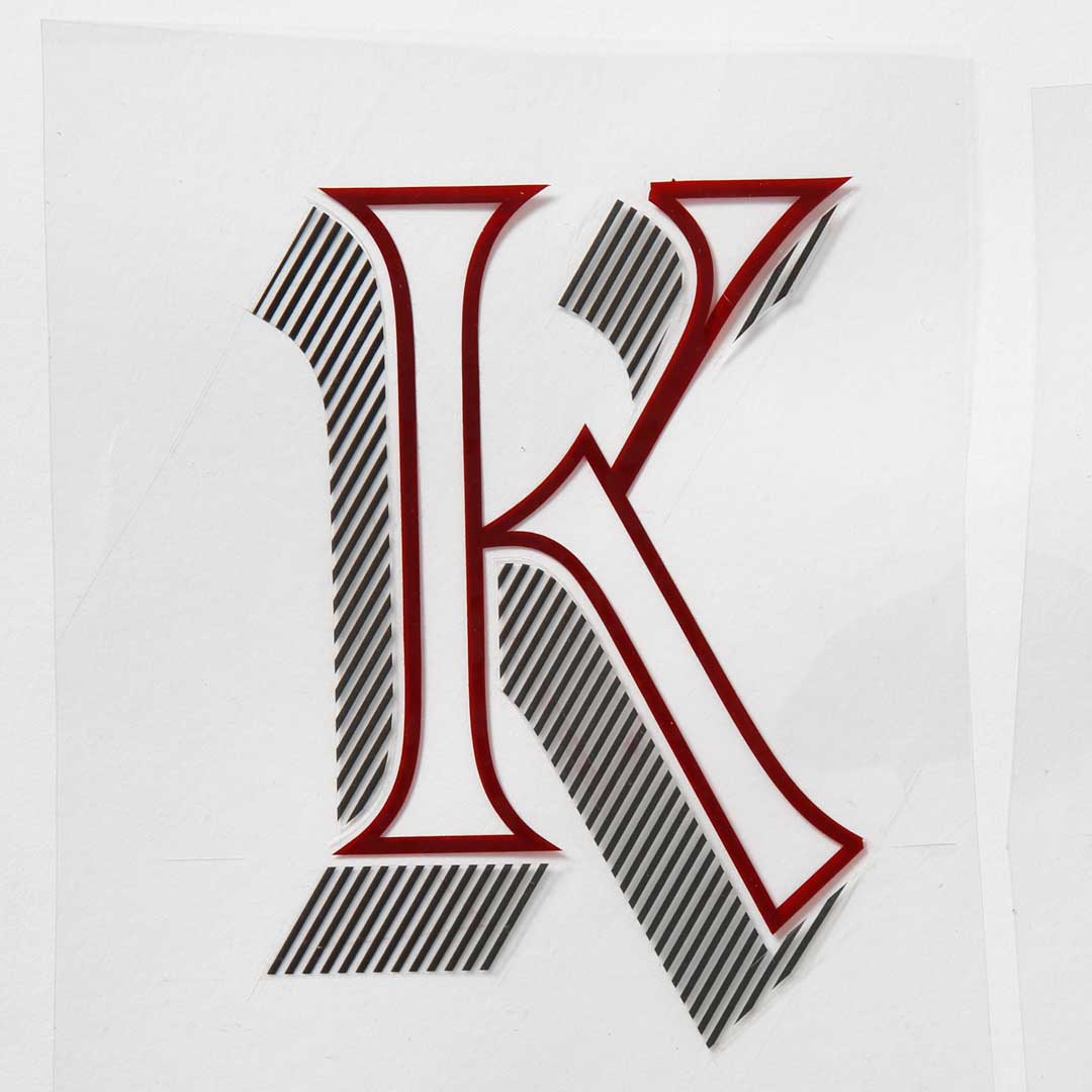 Freda’s rubylith cut of Letraset Talisman capital ‘K’.