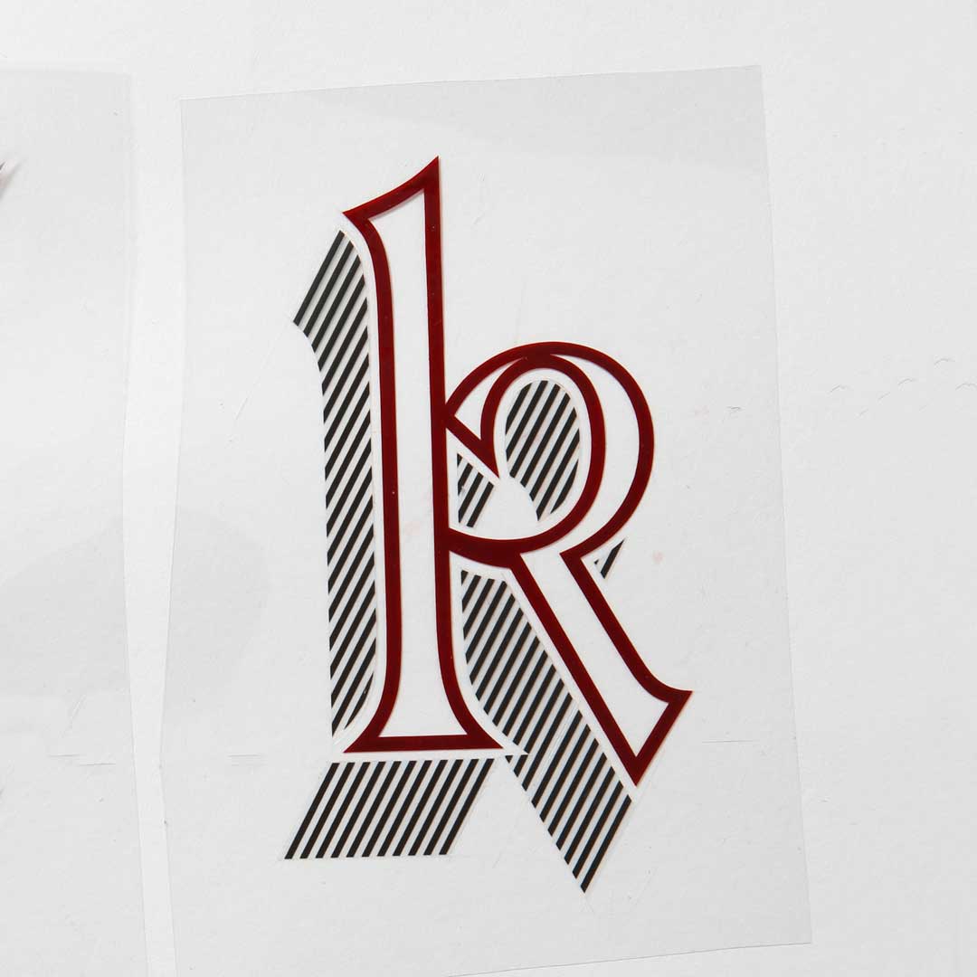 Freda’s rubylith cut of Letraset Talisman lowercase ‘k’.