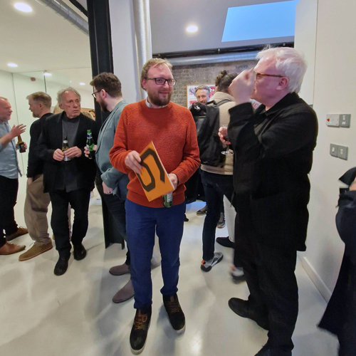 Wim Crouwel friends and enthusiasts share a glass and a chat.